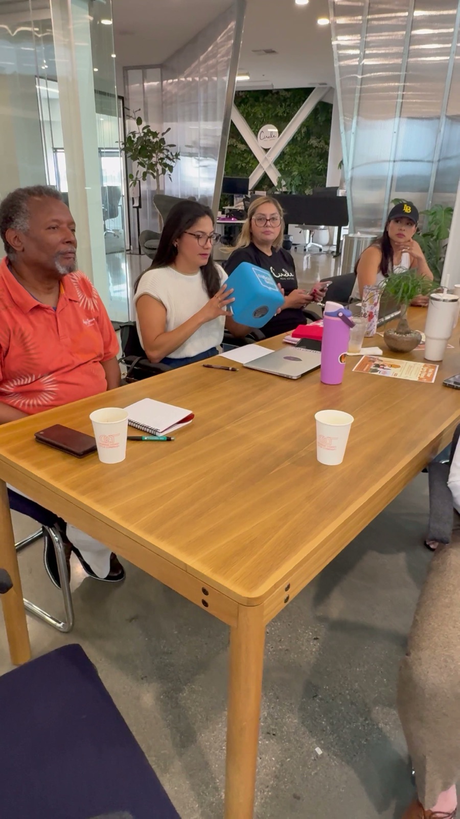 Agents at the table in front of the Circle wall