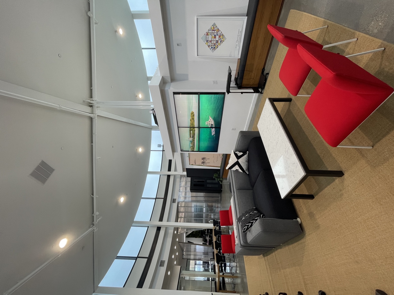 Circle Real Estate lounge with video wall where lead pipeline reviews happen